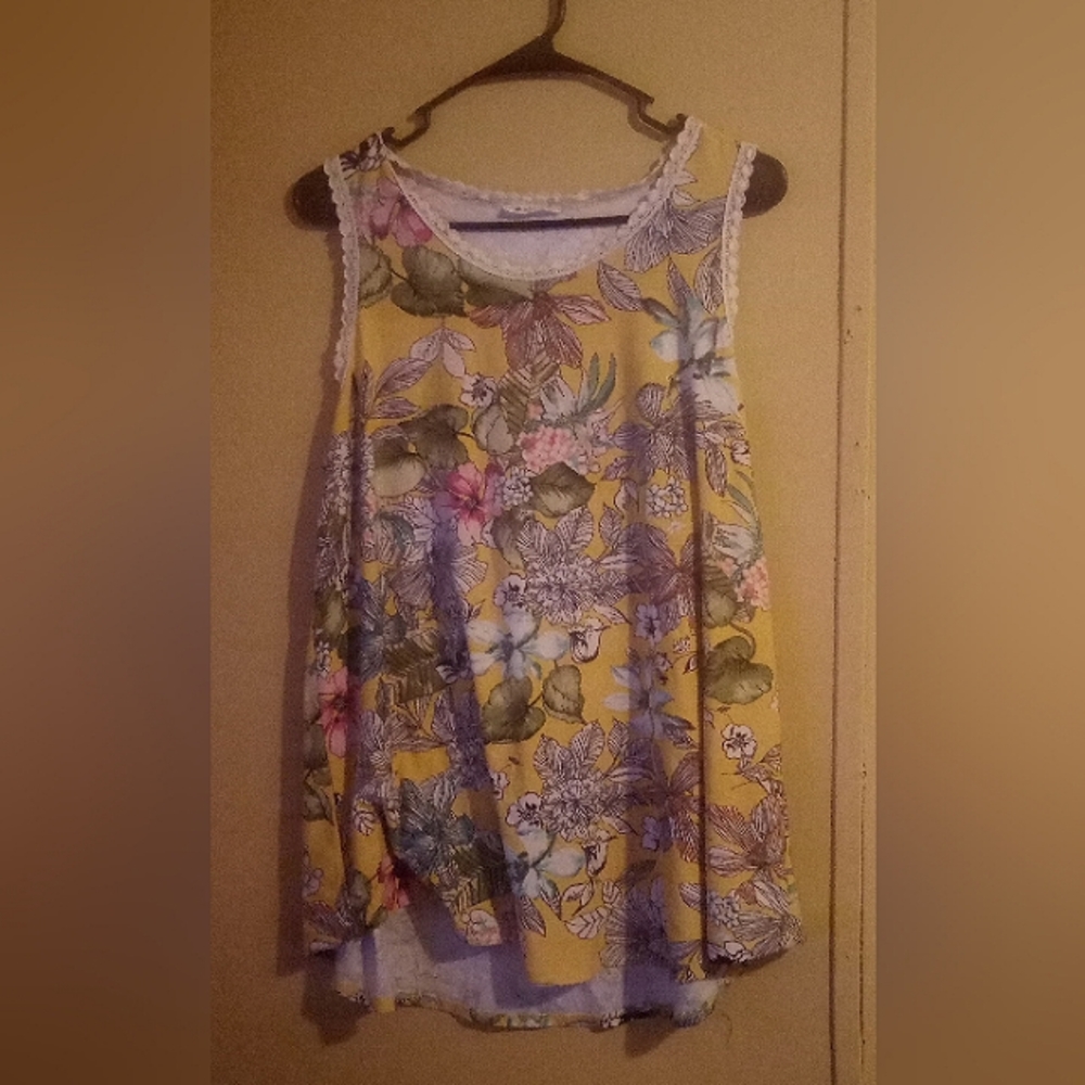 Yellow/multicolor, floral sleeveless blouse.